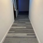 Grey SPC flooring installed in Arabian Ranches hallway